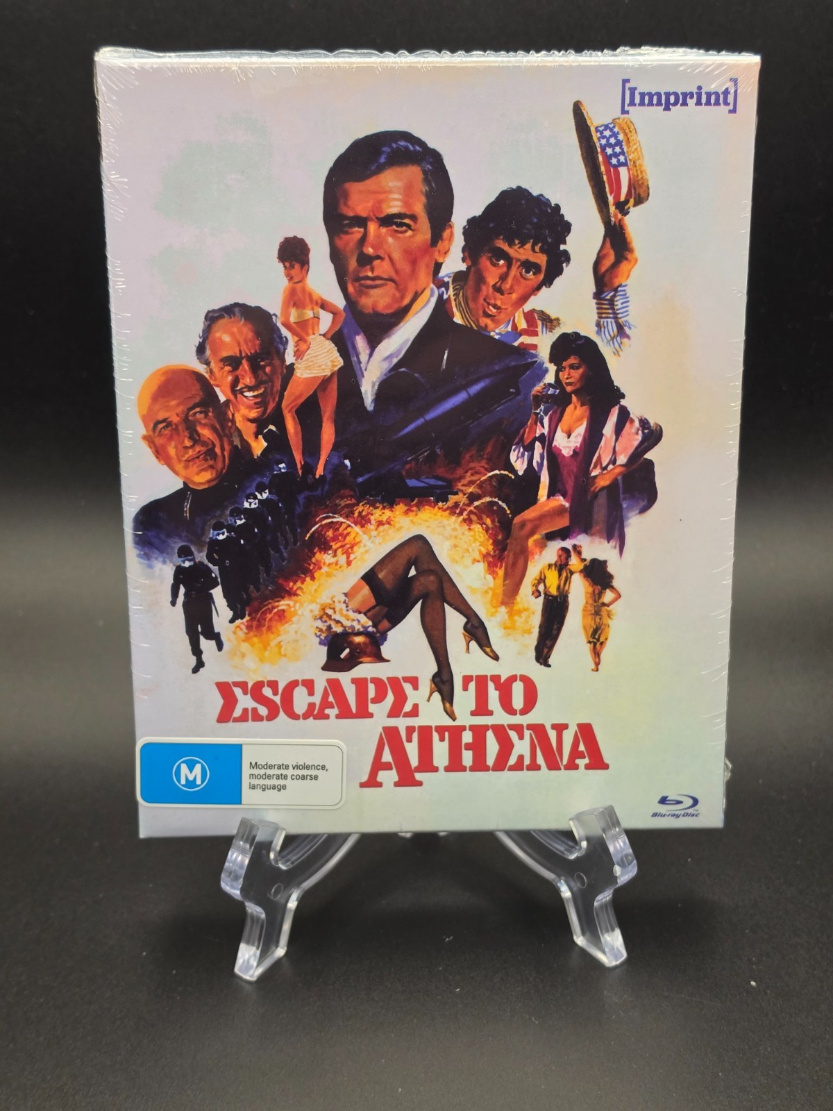 Escape to Athena (1979) – Imprint, Roger Moore, SEALED NEW, SLIPCOVER